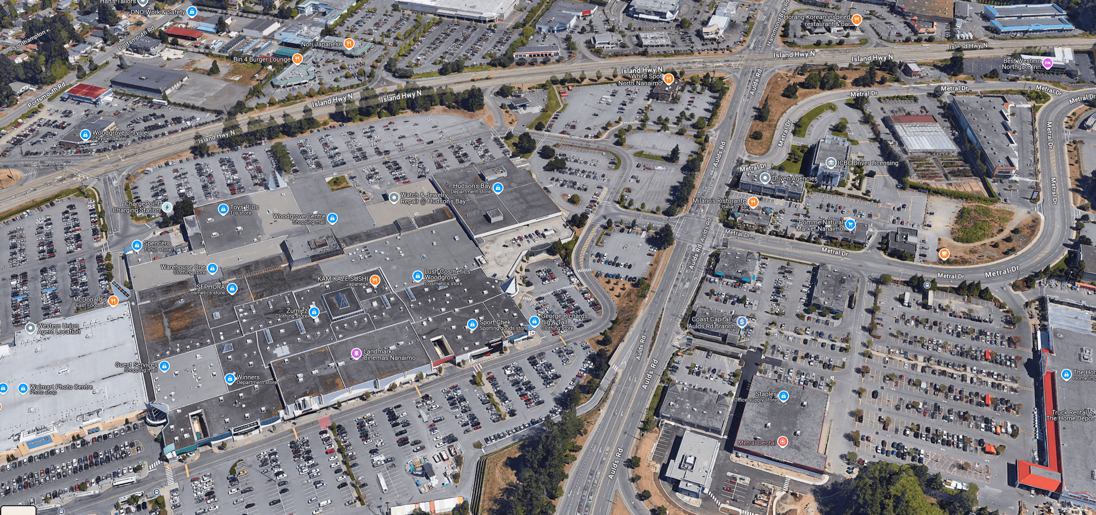 We have allowed our city to be dominated by auto-oriented uses, leading to unpleasant, dangerous, and unproductive urban spaces. Our off-street parking bylaws have been built to favour stip malls over vibrant urban areas. (Google Maps)