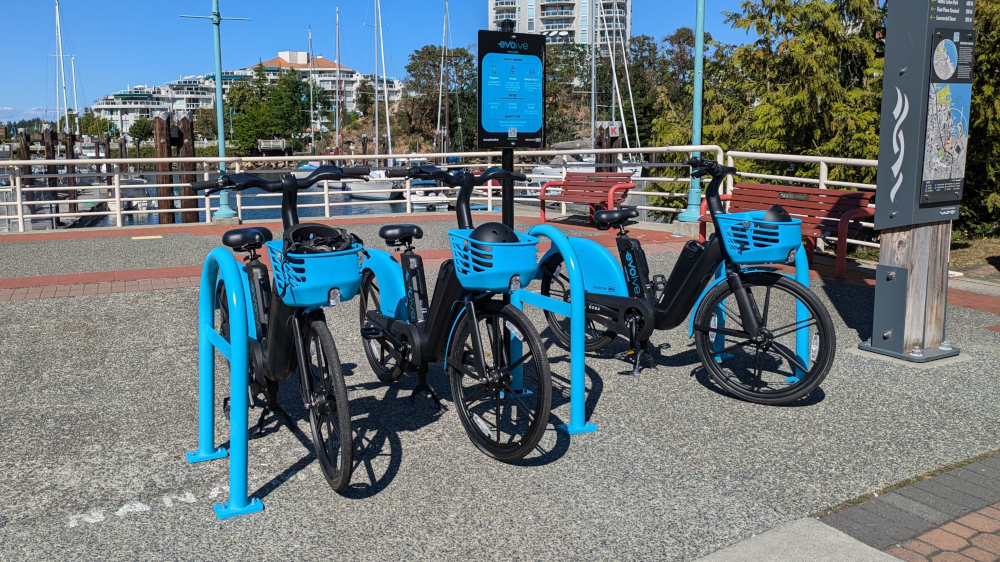 Even more Evo e-bikes parked along the Front Street seawall next to the dedicated cycle lanes. (Strong Towns Nanaimo)